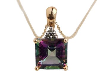 May include: A gold chain necklace with a square-shaped pendant featuring a large, iridescent gemstone surrounded by smaller diamonds.