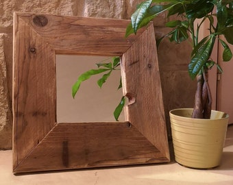 Mirror with reclaimed old wooden frame, decoration to be placed on consoles and bookcases in Nordic style, rustic modern