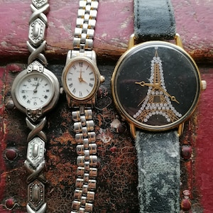 vintage watch, vintage watches, lot of vintage watches, old time pieces, eifel tower souvenir, stainless steel, ladies wristwatch,