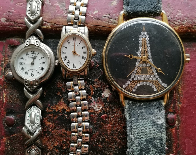 vintage horloge, vintage horloges, veel vintage horloges, oude tijd stukken, eifel toren souvenir, roestvrij staal, dames polshorloge,
