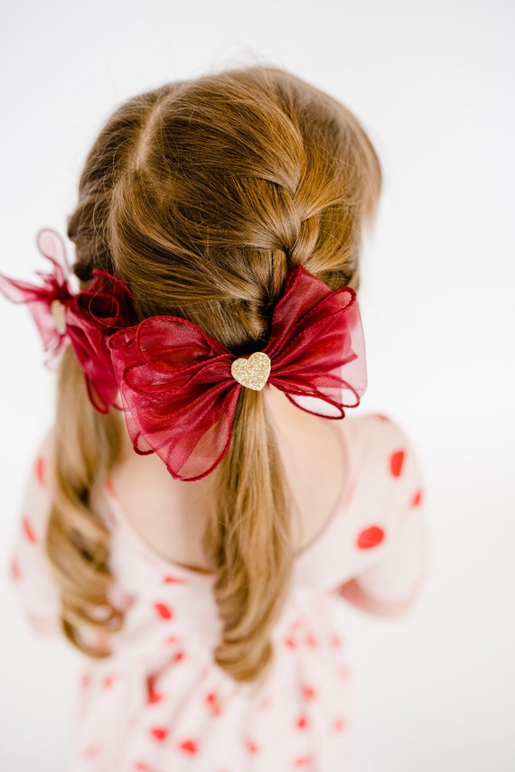 Image of Ponytail with a heart-shaped bow for Valentine's Day