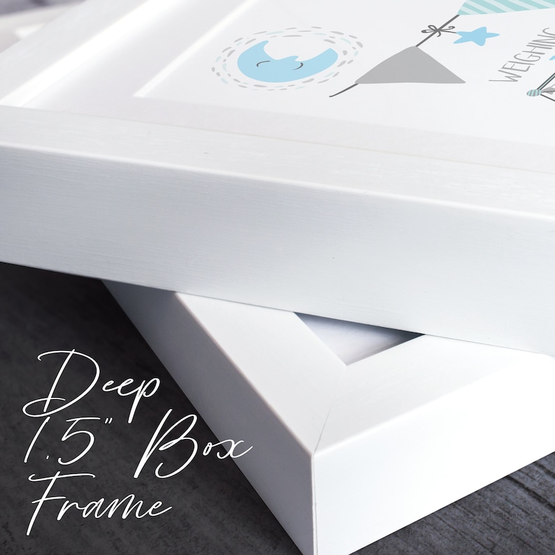 May include: White picture frame with a 1.5" deep box frame. The frame is made of wood and has a smooth finish.