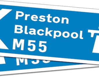 May include: Blue and white road sign with a white arrow pointing left and the text "Preston Blackpool M55" and a white icon of a highway with two lanes.