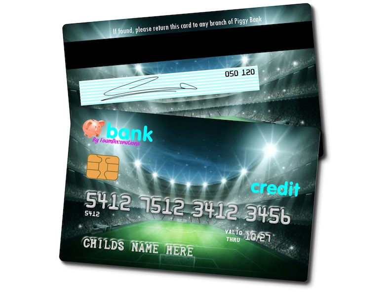 May include: A green and black credit card with a soccer stadium background. The card has the text "credit" in blue, "bank" in pink, and "By FoamDecorations" in white. The card number is 5412 7512 3412 3456. The card also has the text "VALID 10/27 THRU" and "CHILDS NAME HERE".