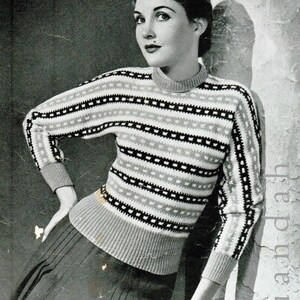 May include: A black and white striped sweater with a crew neck. The sweater has a geometric pattern in the stripes.