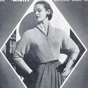 May include: Vintage knitting pattern book cover featuring a woman in a light-colored cardigan with a button-down front and a dark skirt. The cover has the text "404 Patterns Knitting Book 404" in a stylized font, set against a diamond-shaped design.
