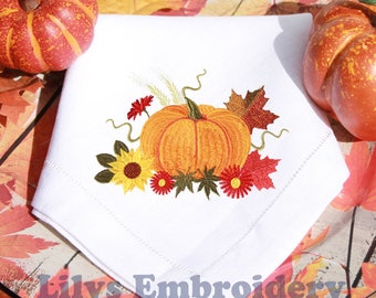 May include: White embroidered napkin with an autumnal design. The design includes an orange pumpkin, yellow sunflowers, red flowers, and fall leaves. The text "Lilys Embroidery" is at the bottom.