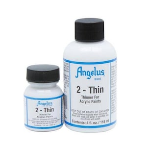 May include: Two white bottles of Angelus 2-Thin acrylic paint thinner. The bottles have black caps and blue and white labels. The larger bottle contains 4 fl. oz. / 118 ml.