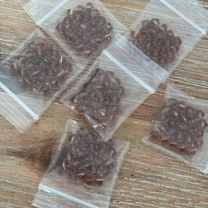 Genuine Swarovski Crystal 4mm Bicone Beads | Lt Smoked Topaz | 24 beads