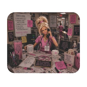 May include: A doll dressed in pink scrubs sits at a desk in a hospital setting, holding a telephone receiver. The desk is covered with papers, a stethoscope, a pink tumbler, a coffee cup, and various signs with humorous text about nursing.