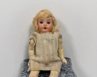 Creepy antique doll
