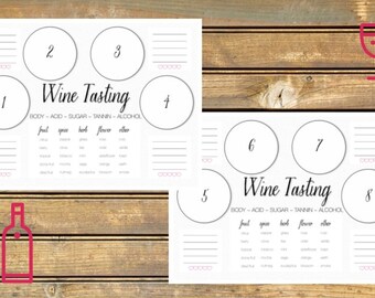 Può includere: Due fogli di degustazione del vino stampabili con cerchi numerati per otto vini diversi. Ogni foglio ha una sezione per appunti su corpo, acidità, zucchero, tannini, alcol, frutta, spezie, erbe, fiori e altro.