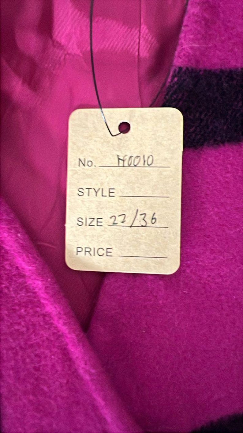 May include: Close-up of a tag attached to a magenta fabric. The tag reads "No. H0010", "SIZE 22/36". The fabric has a plaid pattern with black stripes. The tag is attached with a black string.