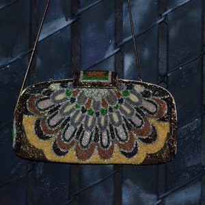 brown golden beaded clutch metal strap roaring 20s flapper peacock like design made by Jeromes Hong Kong, metal frame rectangle clasp 10 x 6