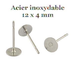 Op de afbeelding: Drie zilveren oorbelpennen met 12 mm ronde pads. Acier inoxydable 12 x 4 mm.
