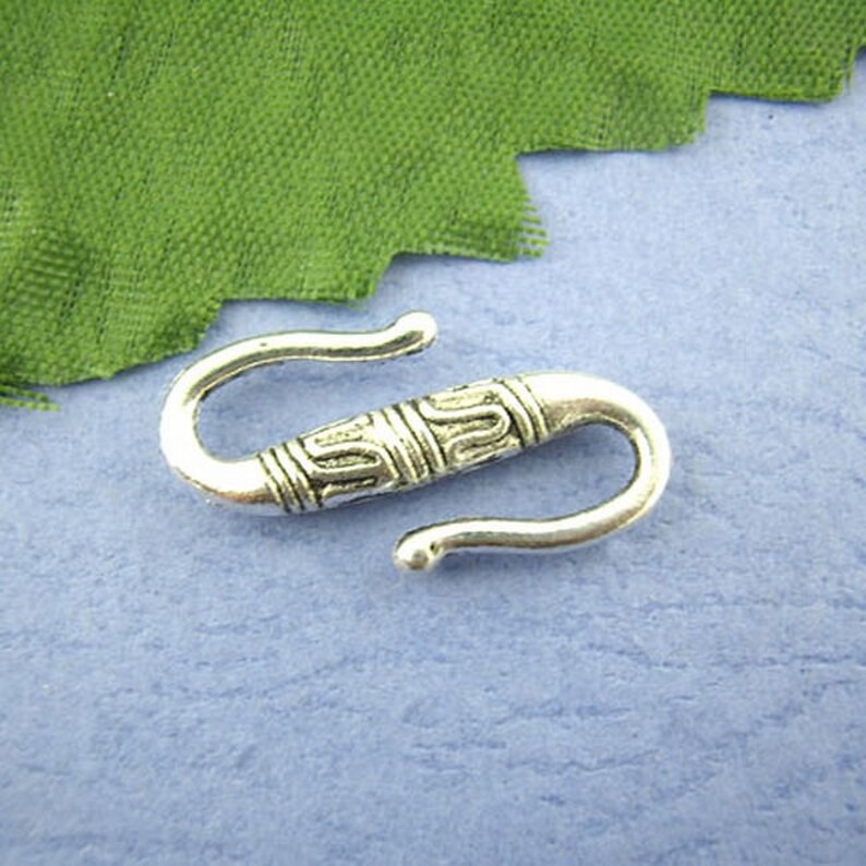 Lots of S or antiqued silver connectors clasps