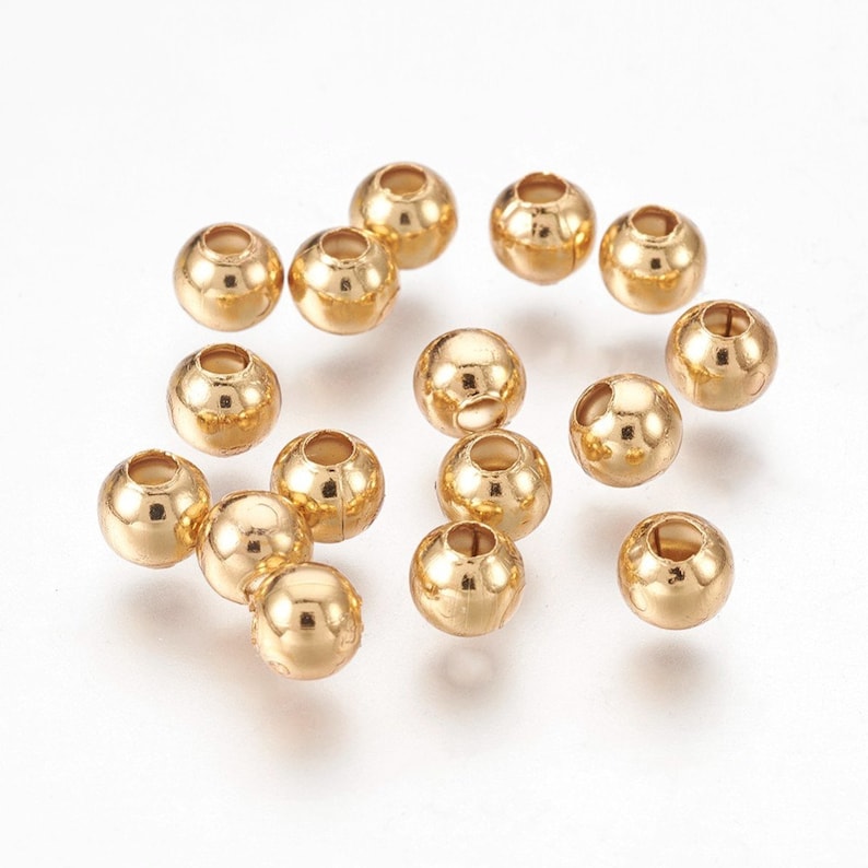 50 perles de 5 mm dorées en acier inoxydable image 1