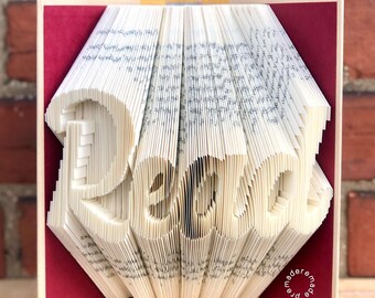 Escultura artística de libro plegado: decoración de libros reciclados «Leer»