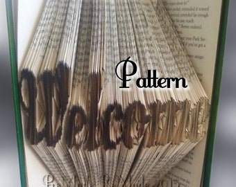 May include: A book with pages folded into the shape of the word "Welcome". The book is open and the pages are fanned out to create a 3D effect. The word "Pattern" is written in black text on the book.