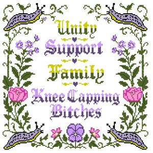 May include: A cross-stitch pattern featuring the text Unity, Support, Family, Knee Capping Bitches in purple and yellow gradient lettering. The design is framed by green vines, pink roses, purple pansies, and four spotted purple slugs in the corners.