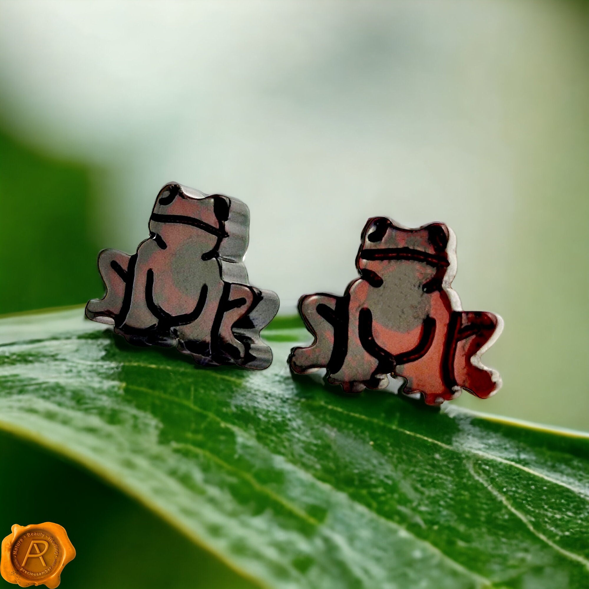 Orecchini a rana in argento Sterling e ambra del baltico
