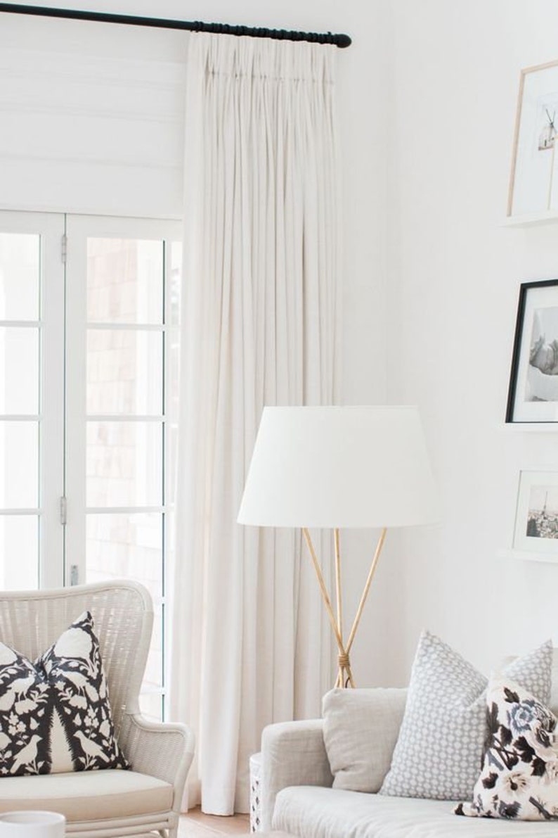 This living room with serene decor features Belgian linen curtains made custom by this Etsy shop.