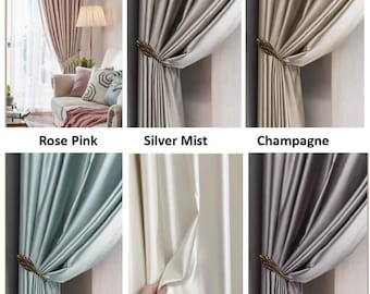 Puede incluir: Una colección de seis cortinas de colores sólidos en rosa, niebla plateada, champán, neblina azul, blanco rubio y lila plateado. Cada cortina tiene un acabado satinado suave y se sujeta con un alzapaños decorativo en forma de hoja dorada.