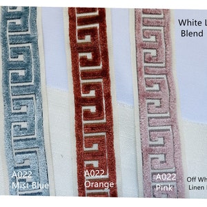 May include: Three samples of trim fabric with a Greek key pattern. The trim is shown in mist blue, orange, and pink. The fabric is described as "White Linen Blend", "Off White Linen Blend", and "A022 Mist Blue", "A022 Orange", and "A022 Pink".