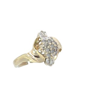 May include: A gold ring with a cluster of small diamonds and baguette diamonds set in a twisted band.
