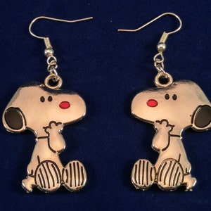 Snoopy! On your ears, in your heart, and happy to see you. Rock the coolest dog in the land.
