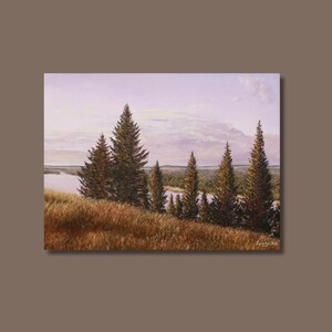 May include: An oil painting depicts a serene landscape with tall evergreen trees and golden-brown grasses in the foreground. A river winds through the distant trees under a soft, lavender-hued sky, creating a peaceful scene.