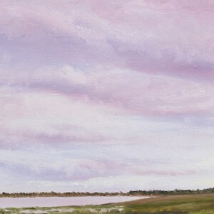 May include: An oil painting of a tranquil landscape, rendered in soft pastel hues. The sky is filled with lavender and pink clouds, while the foreground features a body of water and grassy marshland. The artwork creates a sense of peace and serenity.