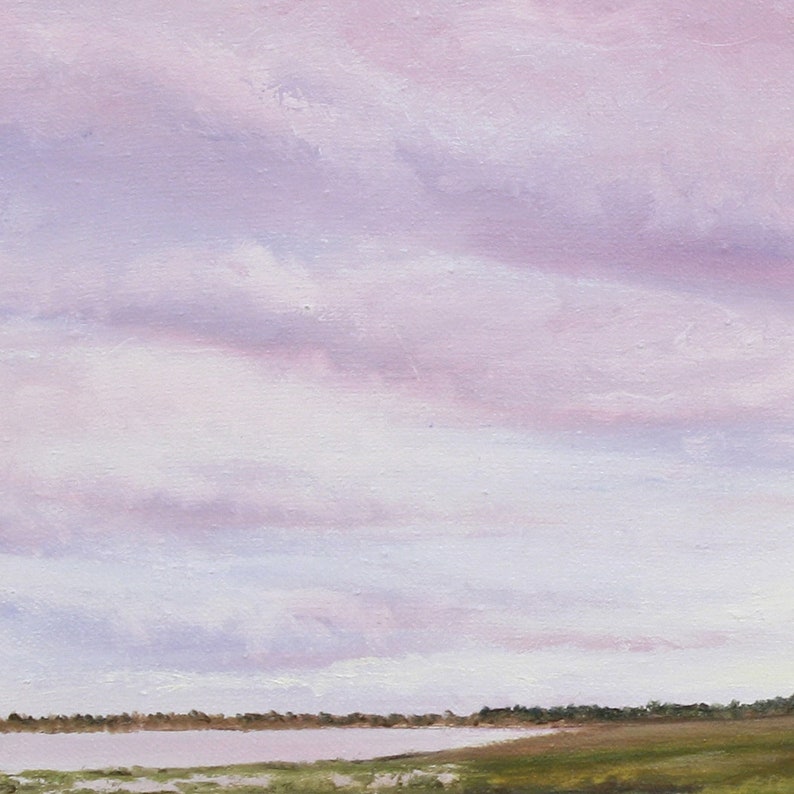 May include: An oil painting of a tranquil landscape, rendered in soft pastel hues. The sky is filled with lavender and pink clouds, while the foreground features a body of water and grassy marshland. The artwork creates a sense of peace and serenity.