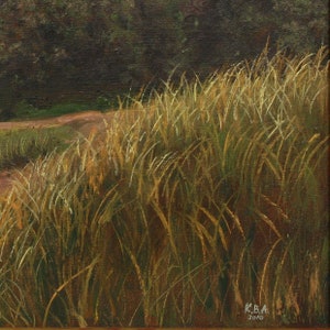 May include: An oil painting depicting a field of tall, golden grasses, with a dirt track in the background. The artwork uses a warm colour palette of greens, browns, and yellows. Signed "K.B.A. 2010" in the lower right corner.
