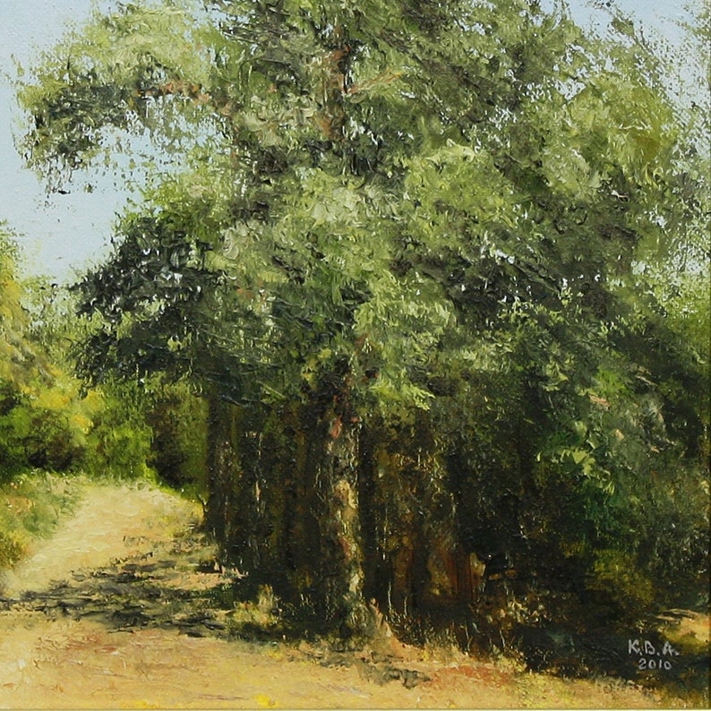 May include: Oil painting of a tree with lush green foliage, casting shadows on a dirt path. The artwork, signed "K.B.A. 2010", captures a sunny day in a natural setting. The path leads into the distance, inviting the viewer to explore.