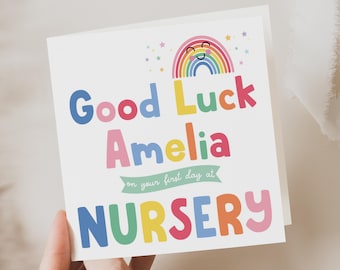 Może przedstawiać: Kolorowa kartka z tęczą i gwiazdami. Tekst brzmi "Good Luck Amelia on your first day at NURSERY".