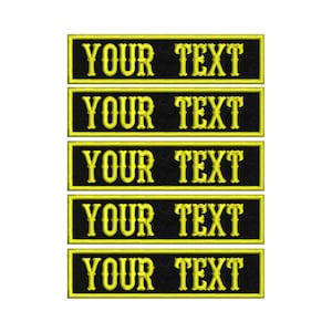 May include: Five black and yellow embroidered patches with the text "YOUR TEXT" in yellow.