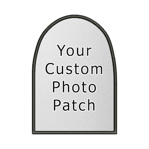 May include: A white, arched, fabric patch with black stitching around the edges. The text "Your Custom Photo Patch" is printed in black on the patch.