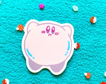 May include: Pink cartoon character sticker with blue eyes and a surprised expression. The sticker is on a turquoise fuzzy background with colorful confetti.