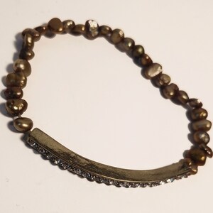 Gold-tone nugget bead bracelet with pave charm