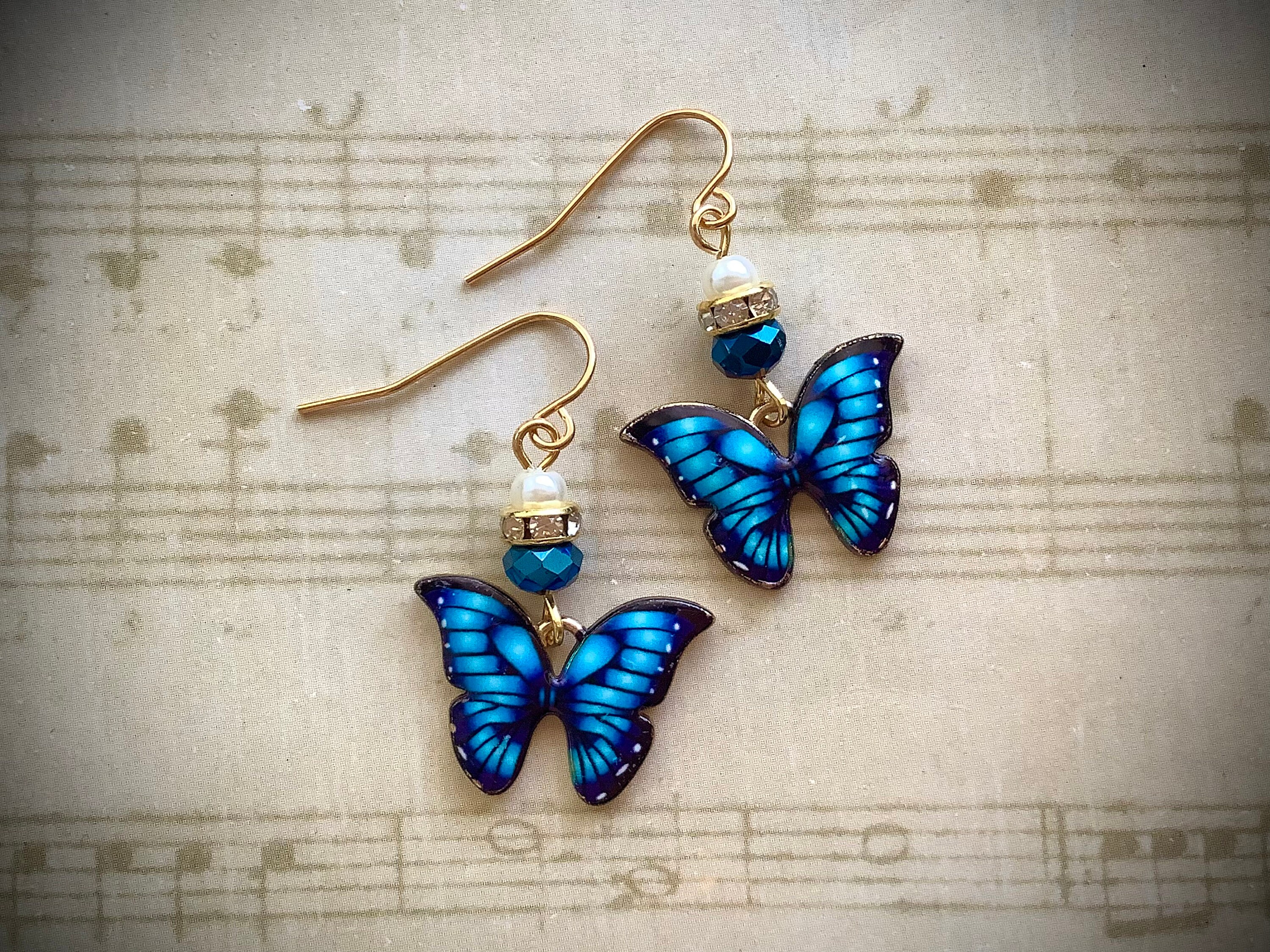 Blue tigers eye, blue butterfly charms, gold metal earrings. – Andria  Bieber Designs