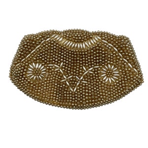 May include: A vintage beaded clutch purse with a cream and gold color scheme. The purse is decorated with a floral pattern and is made of small, round beads.