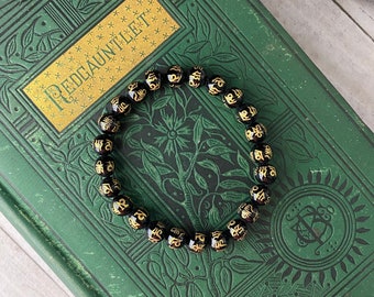 OM Mani Padme Hum Black Onyx Bracelet with Gold Tone Engraving