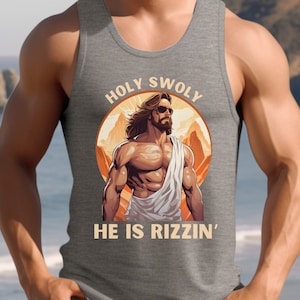 May include: A gray tank top with a graphic of a muscular Jesus figure with the text "HOLY SWOLY HE IS RIZZIN'" in a circle.