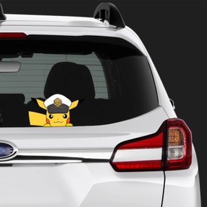 May include: A yellow Pikachu car decal wearing a captain's hat, peeking over the edge of a car window. The decal is affixed to the rear window of a white car, with the taillight visible.