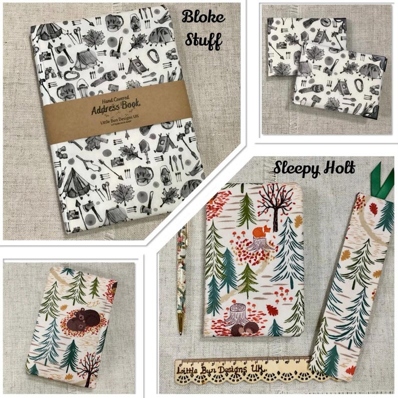 May include: A collection of camping-themed stationery items. Includes an address book, two small notebooks, a pen, a bookmark, and a notebook with a forest design. The address book is wrapped with a brown band and has the text "Hand Covered Address Book".