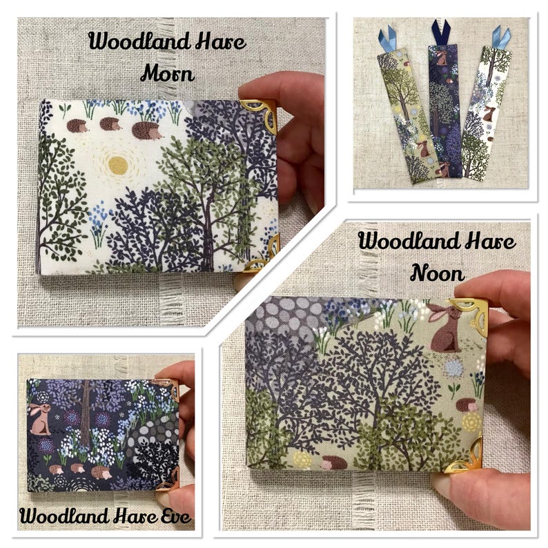 May include: A collection of woodland-themed items. Includes a small box with gold corner protectors and a forest scene with the text "Woodland Hare Morn". Also, three bookmarks with forest scenes and a box with the text "Woodland Hare Noon" and "Woodland Hare Eve".