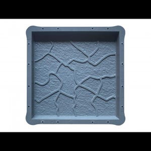 May include: Gray plastic mold for making concrete stepping stones. The mold features a textured design that resembles a cracked stone surface.
