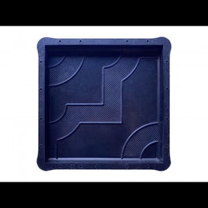 May include: Black plastic mold for creating concrete stepping stones. The mold features a geometric design with a repeating pattern of squares and circles.
