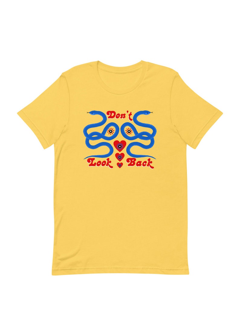 May include: Yellow t-shirt with a graphic design featuring two blue snakes, red hearts, and the text "Don't Look Back" in red. The snakes have yellow eyes and are intertwined.